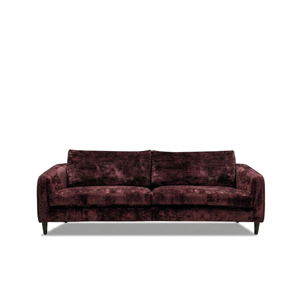 A modern three-seater sofa upholstered in a textured, crushed velvet fabric in a deep burgundy color, shown from a front-facing perspective against a plain white background.